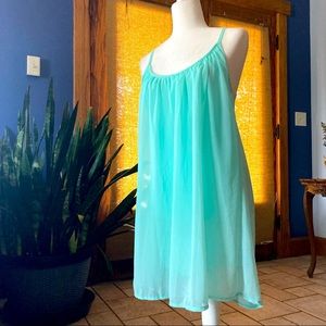 Flirty, chiffon tunic w/ netted racer back detailing